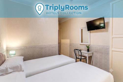 two beds in a hotel room with a tv at TriplyRooms Collection - Roma Colosseo in Rome
