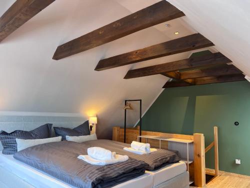 a bedroom with a bed with two pillows on it at Seeblick Cottage in Ziemitz