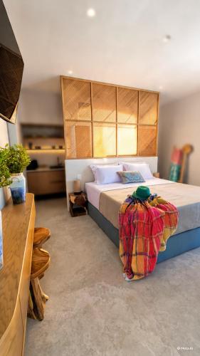 a bedroom with a large bed in a room at Porto Paradiso Seaside Resort in Vromolimnos