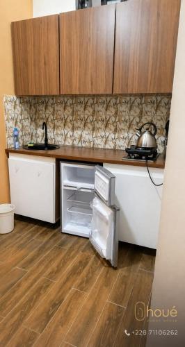 a kitchen with a sink and a counter top at Résidence Houé 