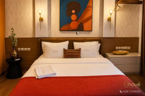 a bedroom with a bed with a book on it at Résidence Houé 