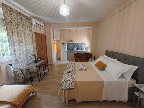 a hotel room with a bed and a dining room at Hotel Europa in Perugia