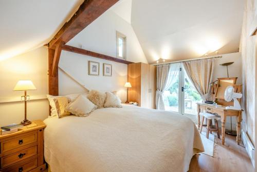 a bedroom with a large white bed and a window at 1 Bed in Battle oc-bt112 in Battle