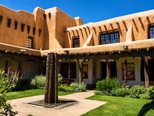 an exterior view of a building in the desert at Las Brisas de Santa fe in Santa Fe