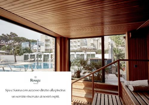 a view from the balcony of a house with a large window at Rouge International Resort in Milano Marittima