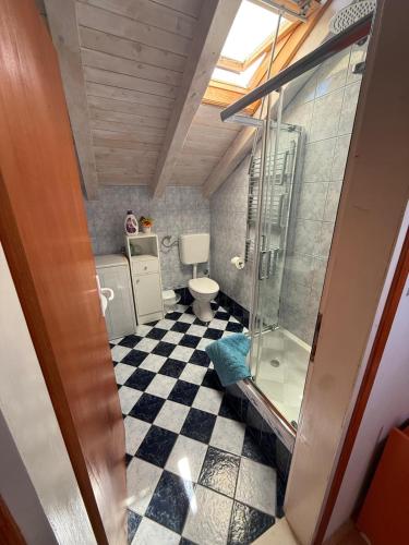 a bathroom with a glass shower and a toilet at Takoma Hvar in Hvar