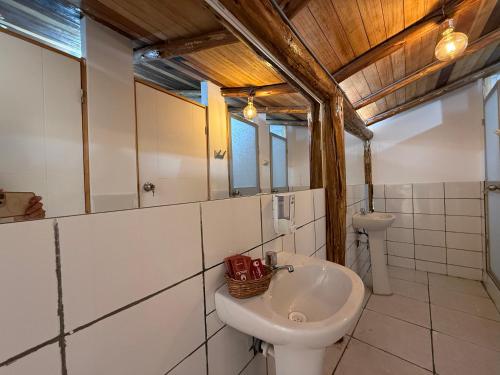a bathroom with a sink and a toilet at Anido House in Ollantaytambo