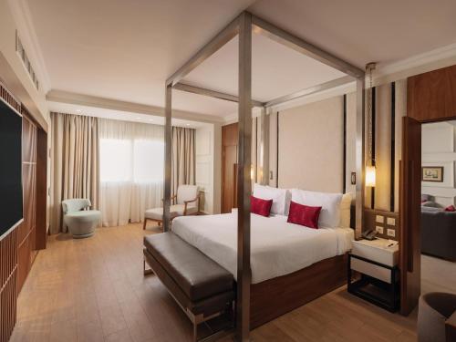 a bedroom with a canopy bed in a hotel room at Sonesta Hotel Tower & Casino Cairo in Cairo