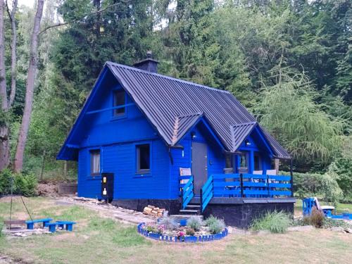 a blue house with a metal roof at Modry Domek Szczyrk domek na wyłączność z kominkiem in Szczyrk