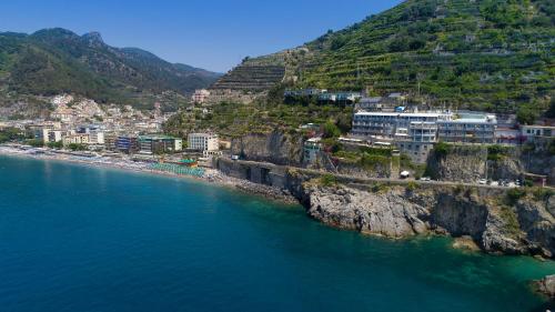an aerial view of a town on a hill next to the water at Hotel Club Due Torri in Maiori
