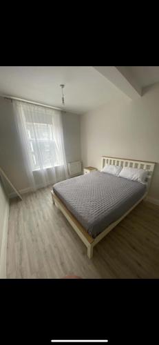 a bedroom with a large bed in a room at The Urban Haven in Limerick