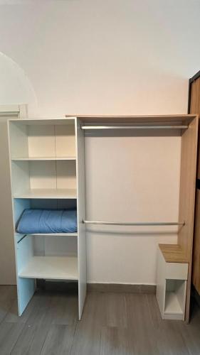 a closet with a bunk bed with a blue pillow at Can Cocollona in Girona