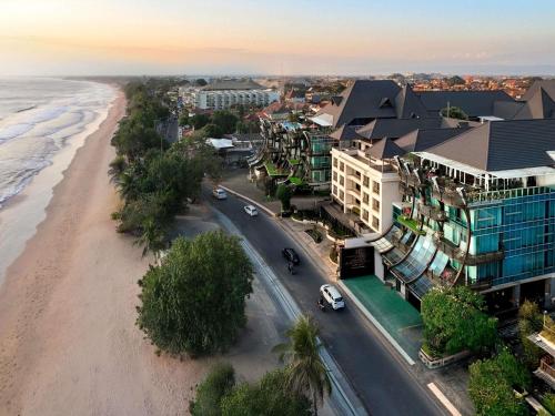 an aerial view of a beach and buildings at The Kuta Beach Heritage Hotel - Managed by Accor in Kuta