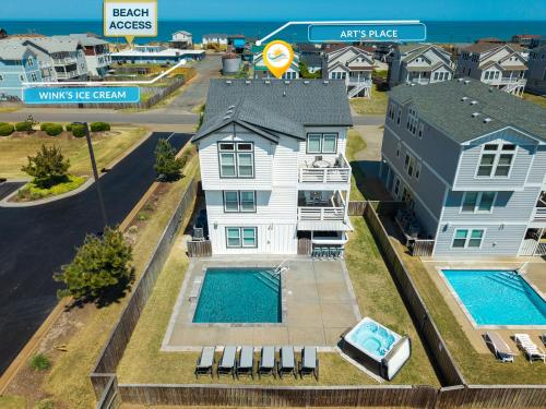 an aerial view of a house with two swimming pools at 4059 - Bikinis Martinis in Kitty Hawk