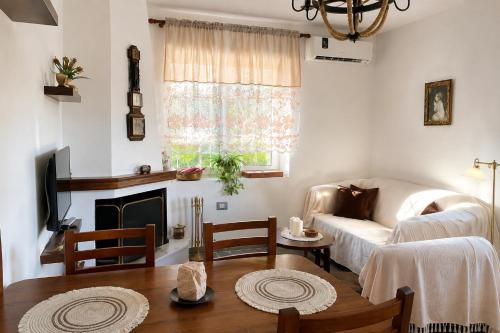 a living room with a couch and a table at Blue Eye Nature Escape 