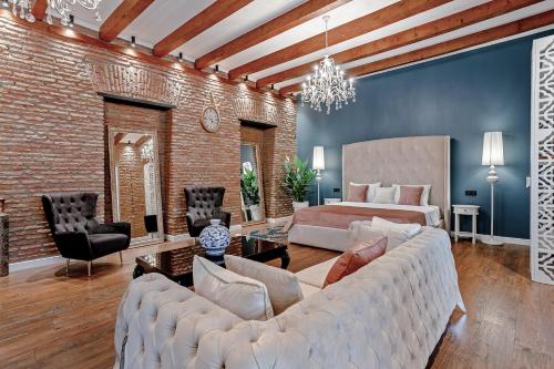 a living room with a large couch and a bed at Eiffel Grand View in Paris