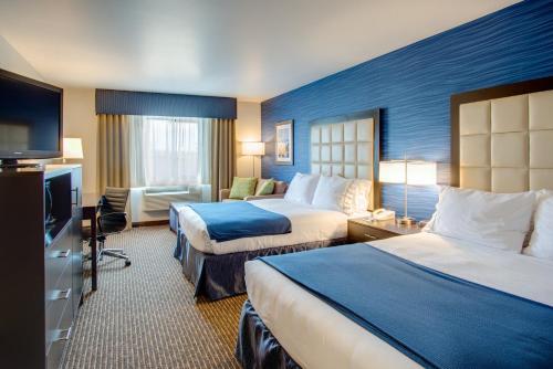a hotel room with two beds and a television at Holiday Inn Express Bellingham by IHG in Bellingham