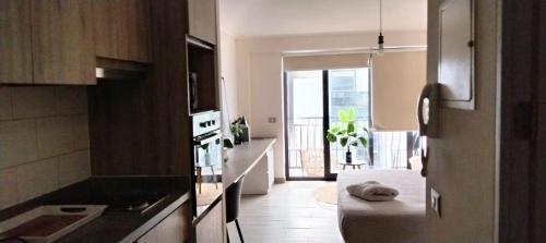 a kitchen with a dog laying on the floor at VIP Suite Antofagasta in Antofagasta
