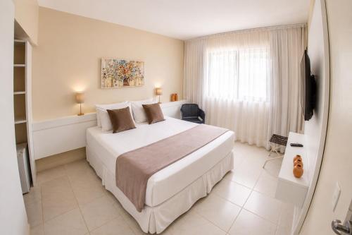 Katil atau katil-katil dalam bilik di Orange Praia Hotel
