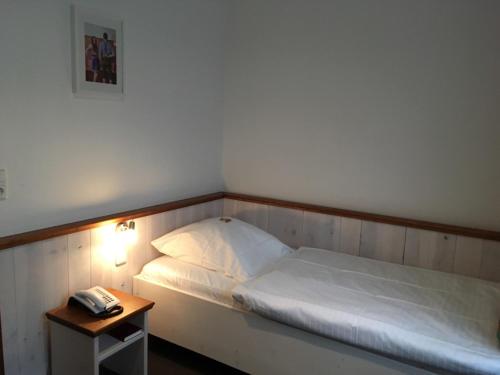 Ein Bett oder Betten in einem Zimmer der Unterkunft Landhaus Wesermarsch