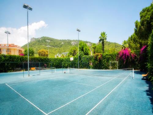 a tennis court with a tennis ball on it at Akka Alinda Hotel - Premium Ultra All Inclusive in Kemer