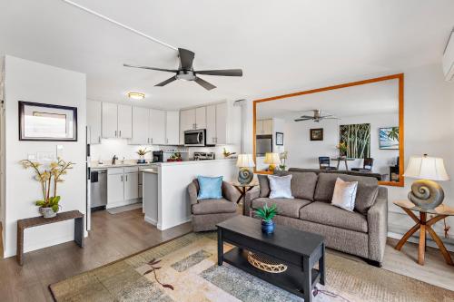 a living room with a couch and a table at OB - Lahaina Roads 308 in Lahaina