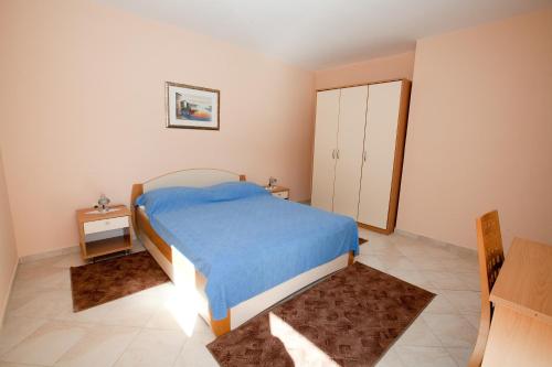 Łóżko lub łóżka w pokoju w obiekcie Apartments Petani
