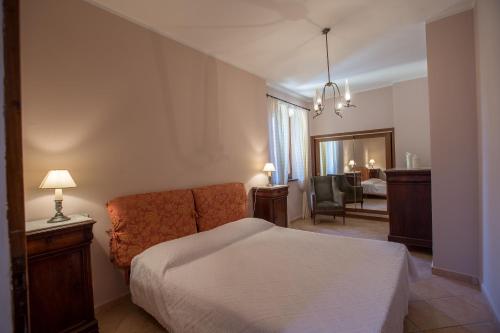 En eller flere senge i et værelse på Agriturismo La Manonera
