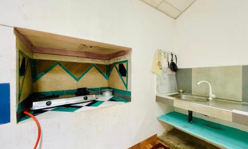 a kitchen with a sink and a counter top at D n A secret Palace in Tangalle