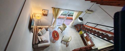 an overhead view of a living room with a couch and chairs at Recovas III in Pilar