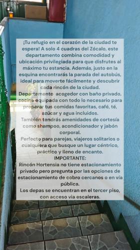 a sign that is on the side of a building at Rincon Hortensia apartments and loft in Oaxaca City