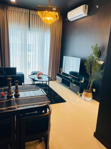 a living room with a couch and a table at Colombo Trizen Nuva Apartments in Colombo