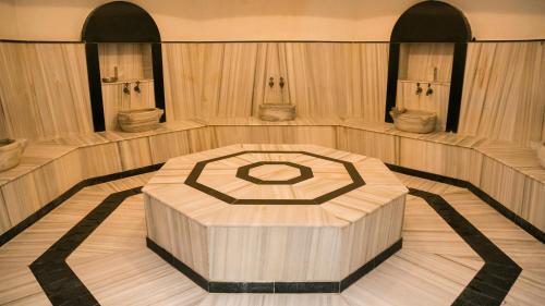 an empty bowling alley with a table in the middle at InterContinental Almaty by IHG in Almaty