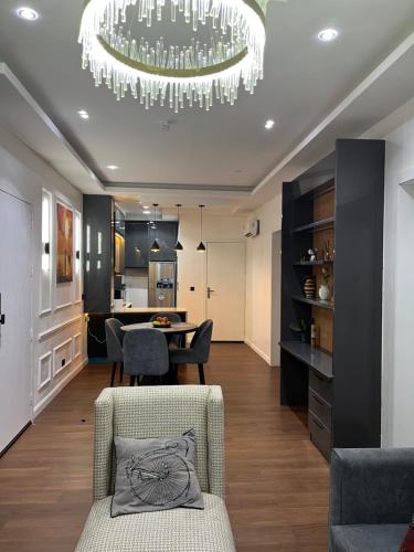a dining room and living room with a chandelier at Pcg Homes in Lagos