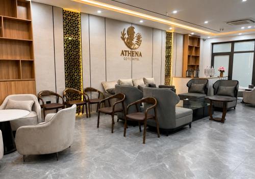 a waiting room with chairs and tables and a salon at Athena Coto Hotel in Nam Cap