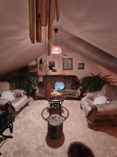 a living room with couches and a table at Pension Relax in Litoměřice