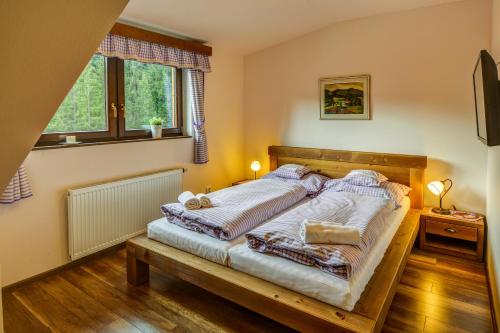 Postel nebo postele na pokoji v ubytování Wellness Hotel Ondrášův dvůr