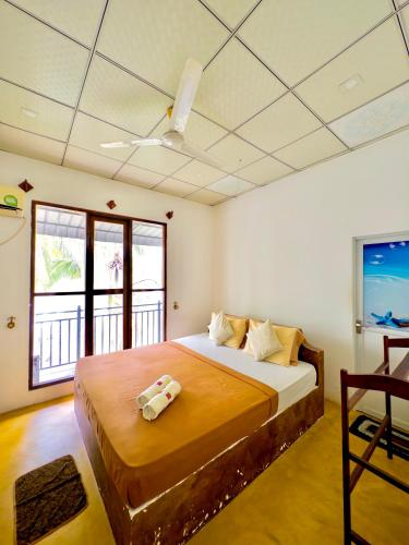 a bedroom with a large bed in a room at Splendid Lake View Safari Lodge in Udawalawe