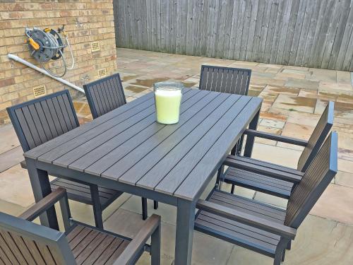 a wooden table with a glass of orange juice on it at Oceans 44 in Bridlington