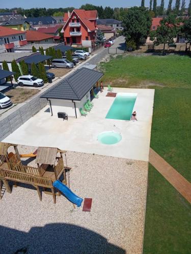 an overhead view of a playground with a slide and a pool at Hotel Velky Meder in Veľký Meder