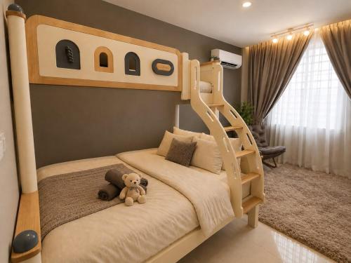 a bedroom with a bunk bed with a teddy bear at Ipoh Meru 3 Bedroom Suites by IWH Suites in Ipoh