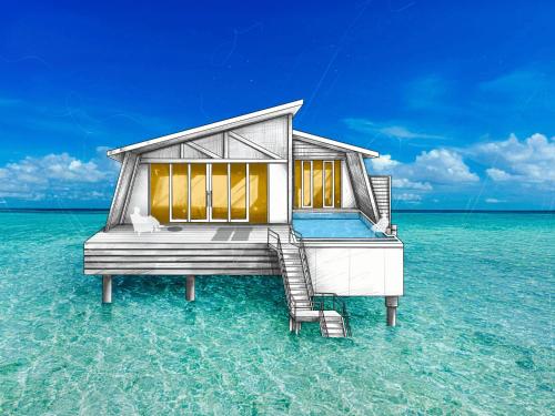 a house on the water in the ocean at Oaga Art Resort Maldives - All Inclusive in North Male Atoll