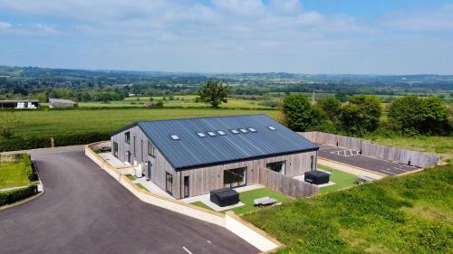 an overhead view of a house with a road at Bears Court in Cheltenham
