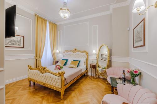 a bedroom with a bed and a living room at Maison 31 - Unique Experience in Civitavecchia