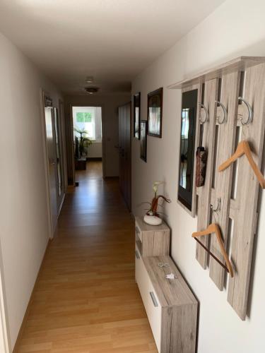 a hallway of a home with wooden flooring and wooden walls at Ferienwohnung Geiseltalsee Frankleben in Frankleben