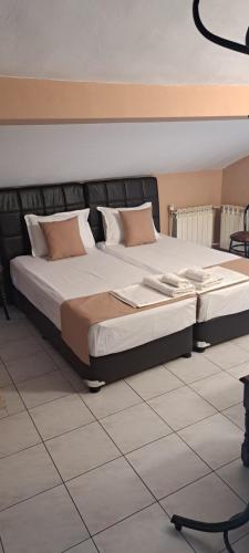 a bedroom with a large bed in a room at Къща за гости "Чекичев" in Svilengrad