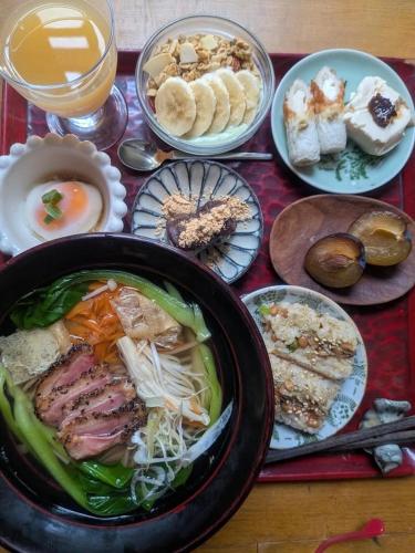 a table with plates of food and a bowl of soup at YAMABE BOSSA inn in Matsumoto