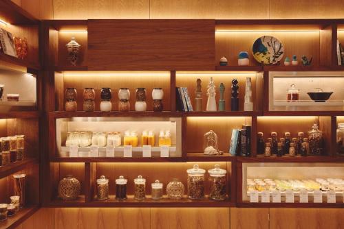a shelf filled with lots of vases and other items at ANA InterContinental Ishigaki Resort by IHG in Ishigaki Island