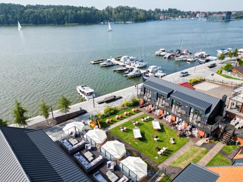 an aerial view of a marina with boats in the water at Kurort Kameralny in Mikołajki