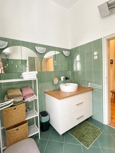 a bathroom with a sink and a mirror at Dinnyés Kúria Dabas in Dabas